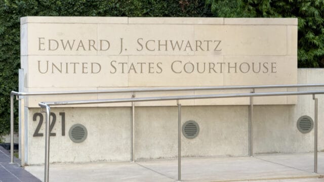 Edward J. Schwartz United States Courthouse sign on a stone wall