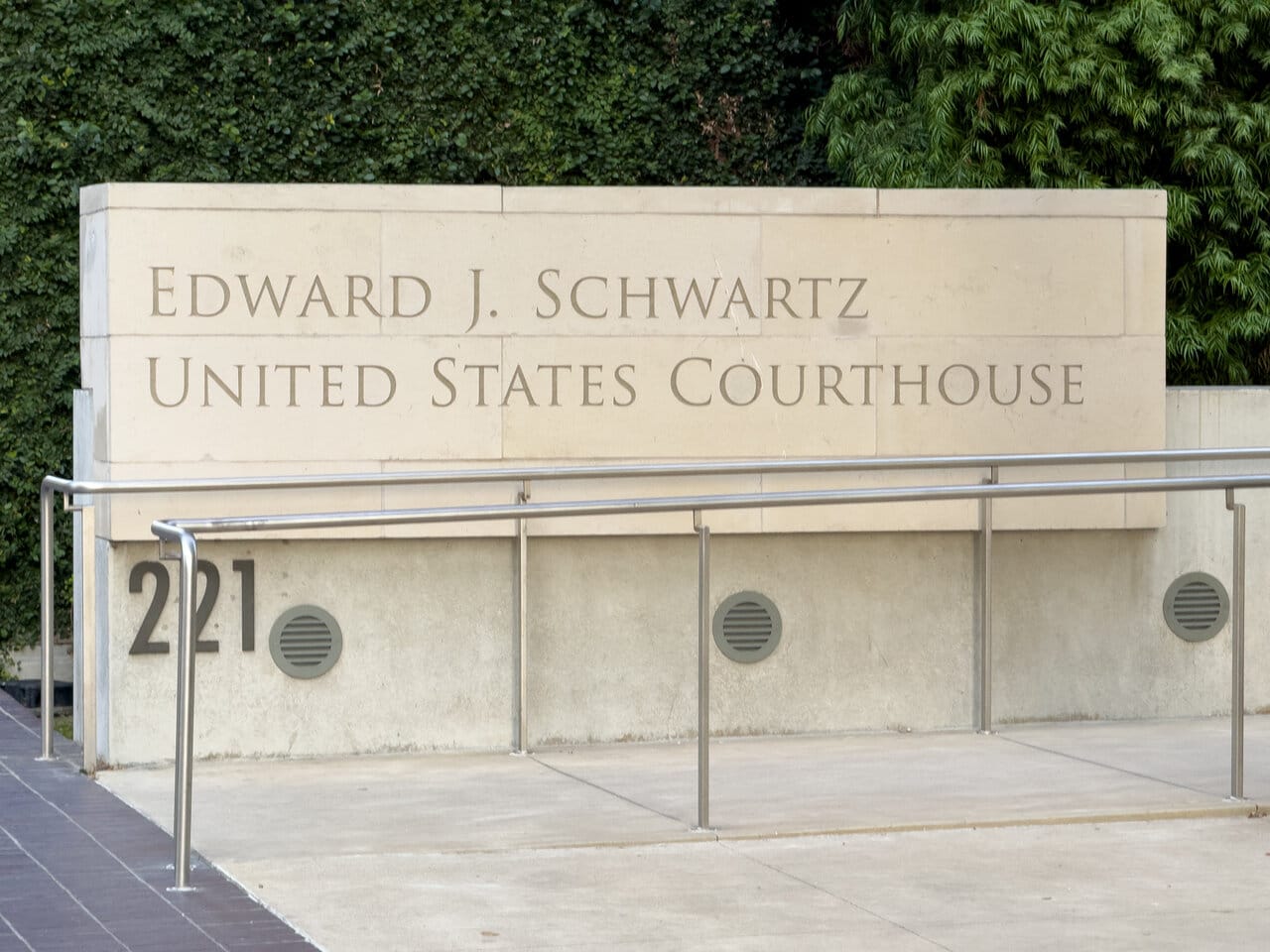 Edward J. Schwartz United States Courthouse sign on a stone wall