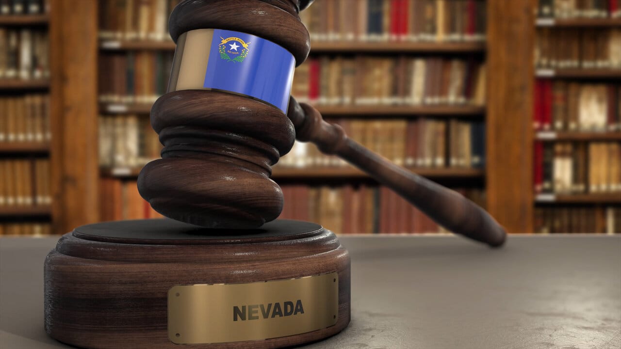 Wooden gavel with a Nevada nameplate on its sounding block in a law library