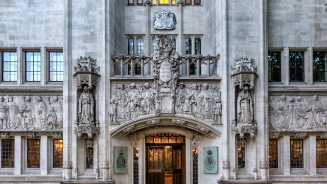 Carved gothic stone entrance of a historic supreme court building