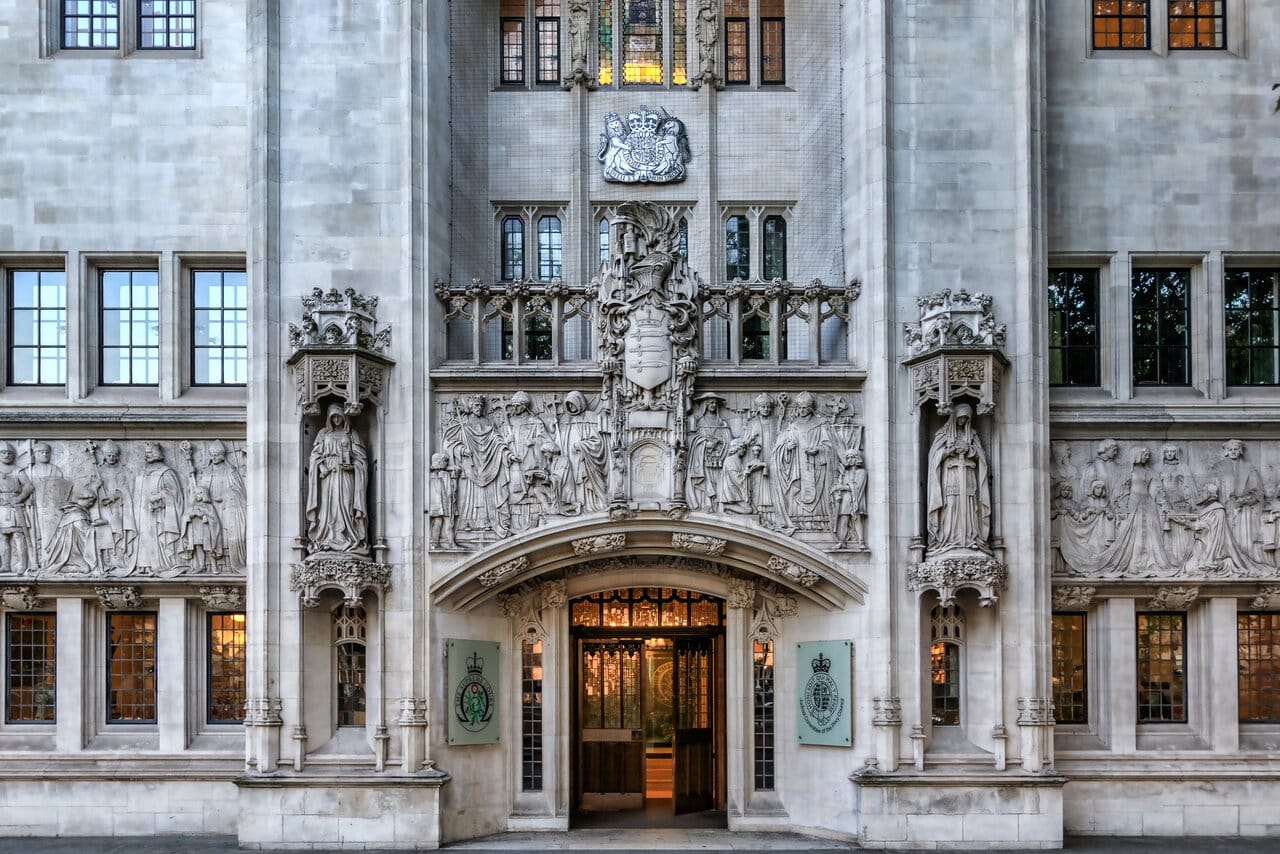 Carved gothic stone entrance of a historic supreme court building