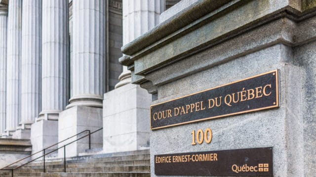 Courthouse entrance with columns and a brass appeal-court nameplate