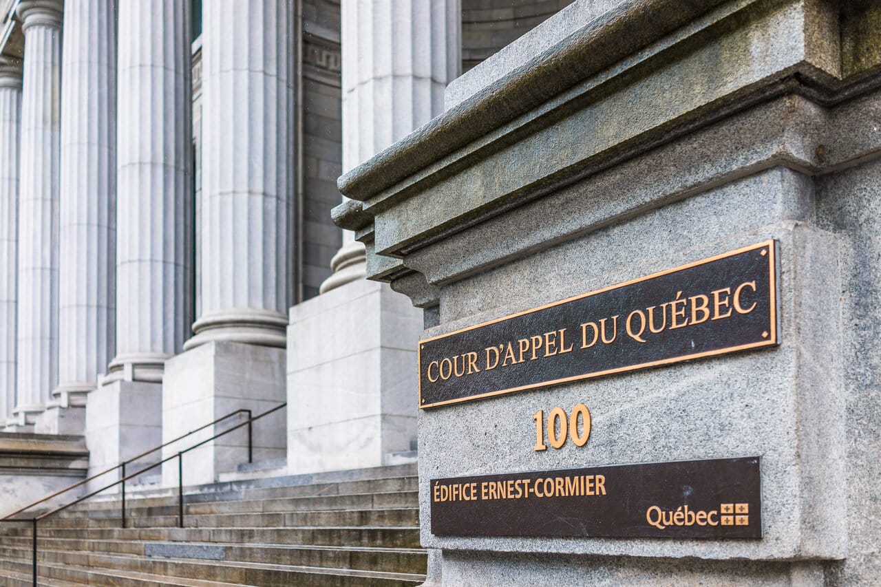 Courthouse entrance with columns and a brass appeal-court nameplate