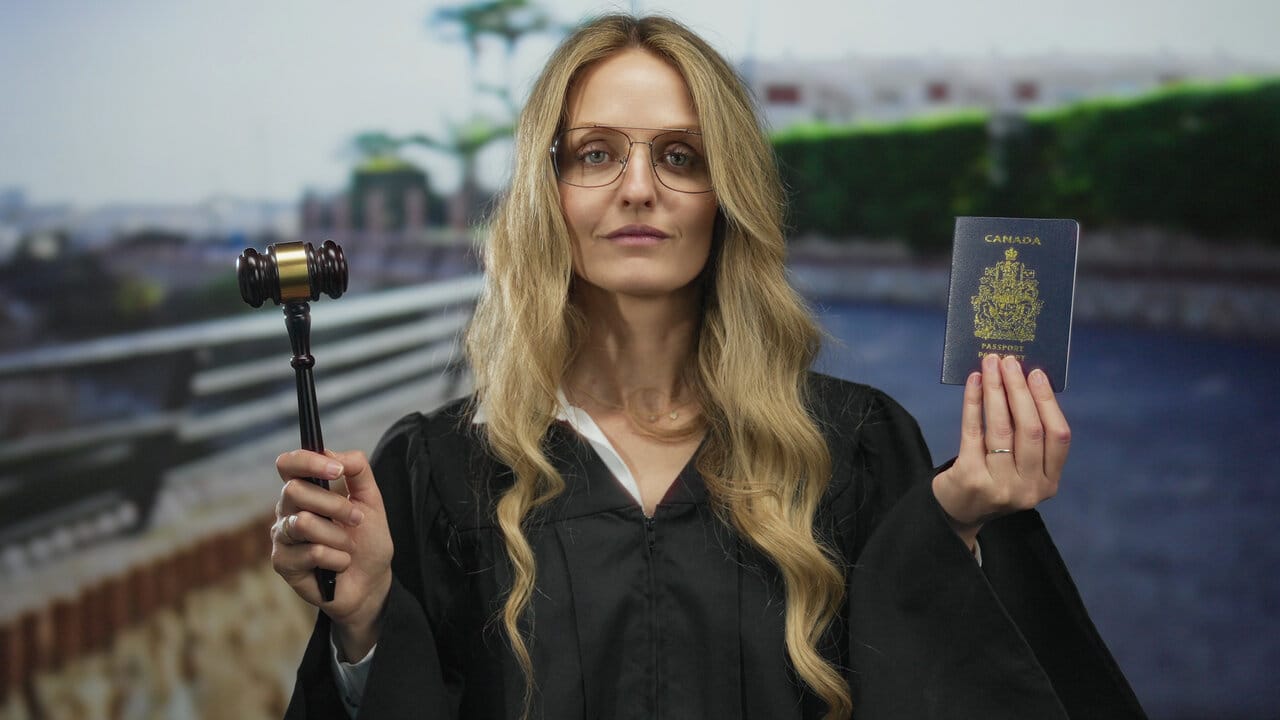 Robed judge holding a gavel in one hand and a credential document in the other
