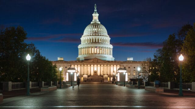 United States Capitol building illuminated at dusk