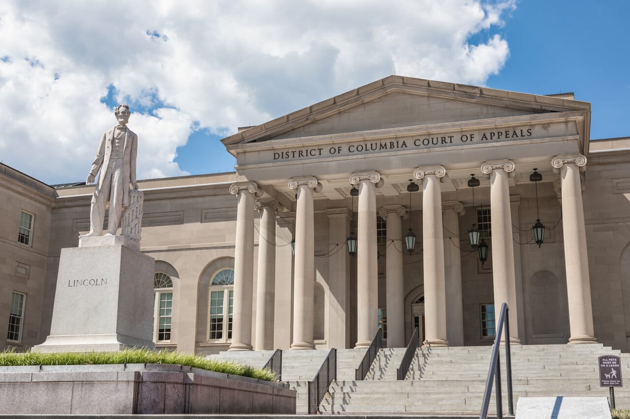 Neoclassical District of Columbia Court of Appeals building with a statue in front