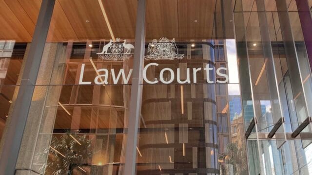 Law Courts lettering on a modern glass building facade