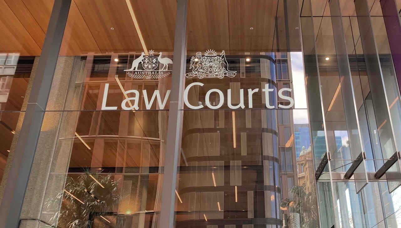 Law Courts lettering on a modern glass building facade
